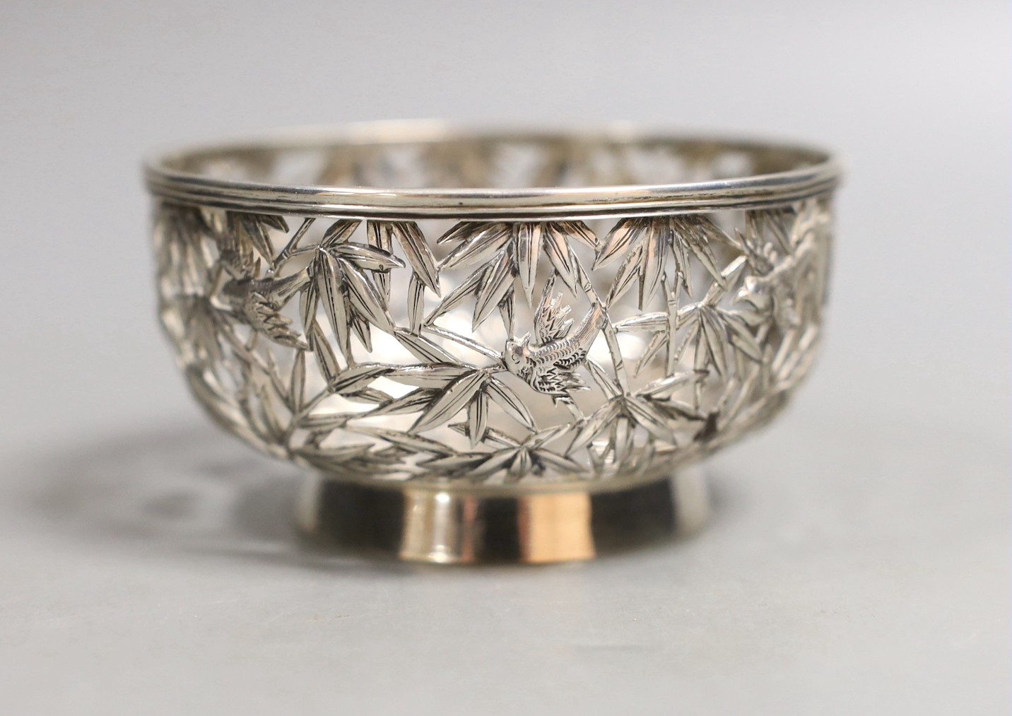 An early 20th century Chinese Export pierced white metal bowl, maker TW, diameter 92mm, 96 grams.